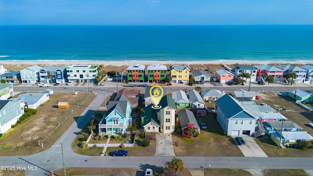 birds eye view of property featuring a residential view and a water view