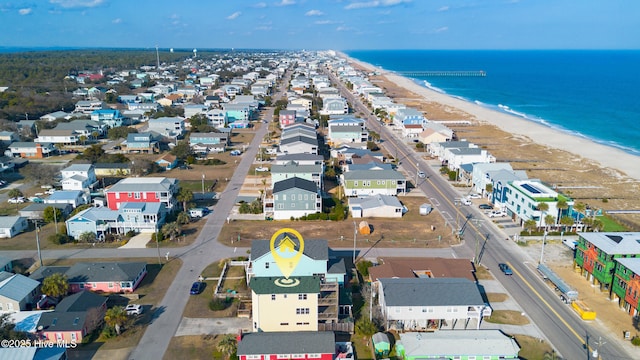 bird's eye view featuring a water view, a residential view, and a view of the beach