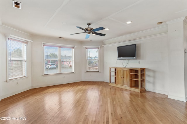 unfurnished living room featuring baseboards, visible vents, and light wood-style floors