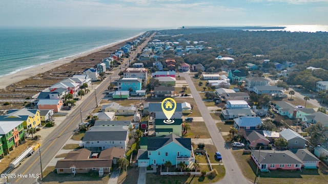 birds eye view of property with a view of the beach, a water view, and a residential view