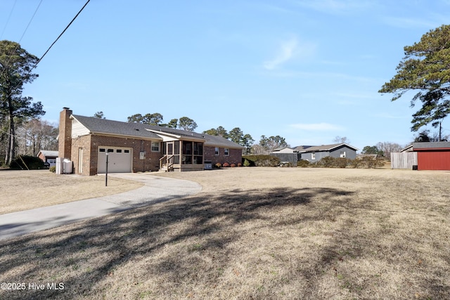 view of front of house with a garage and a front yard