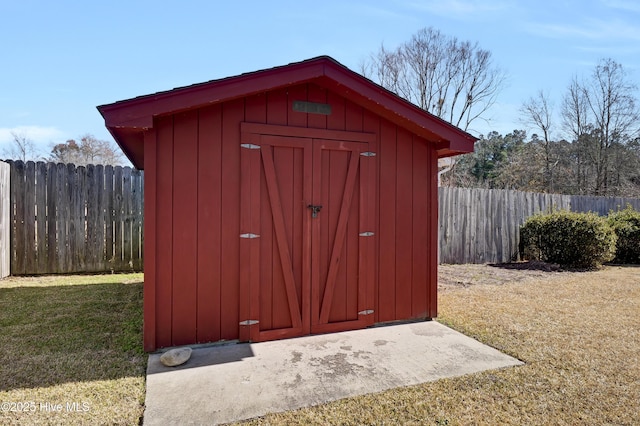 view of outbuilding with a yard