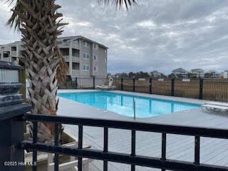 community pool featuring fence