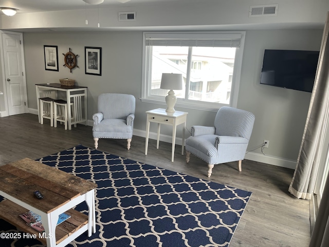 1801 Canal Dr Unit D14, Carolina Beach, NC 28428 - sitting room with wood finished floors and baseboards