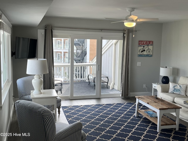 1801 Canal Dr Unit D14, Carolina Beach, NC 28428 - living area featuring wood finished floors, ceiling fan, and baseboards
