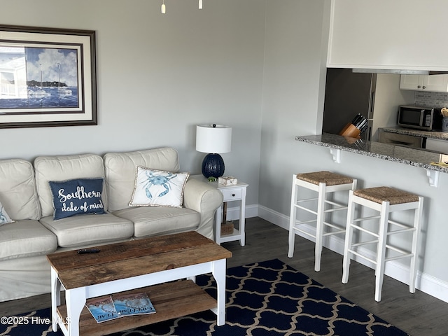 1801 Canal Dr Unit D14, Carolina Beach, NC 28428 - living room with baseboards and dark wood-style floors