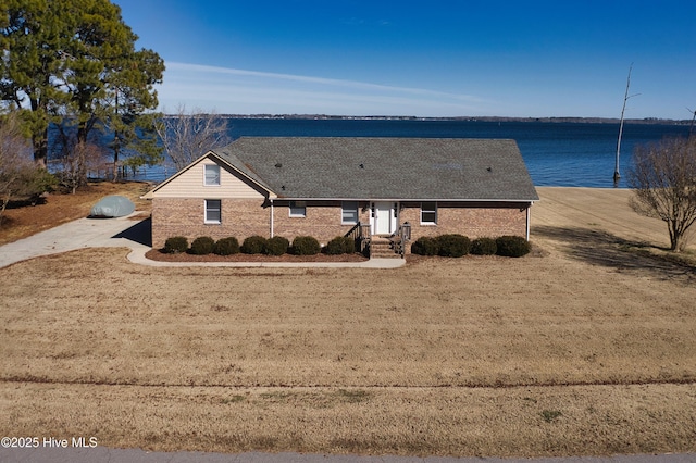 view of front facade with a water view