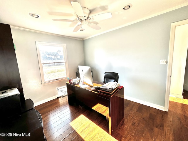 office space featuring ornamental molding, dark wood-type flooring, and ceiling fan