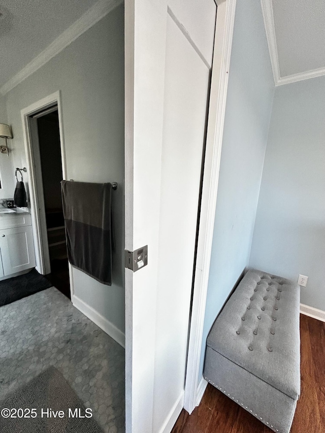 interior space with crown molding and hardwood / wood-style flooring