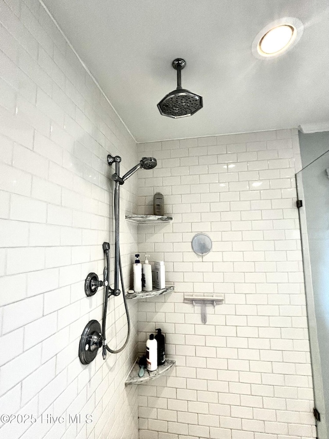 bathroom with tiled shower