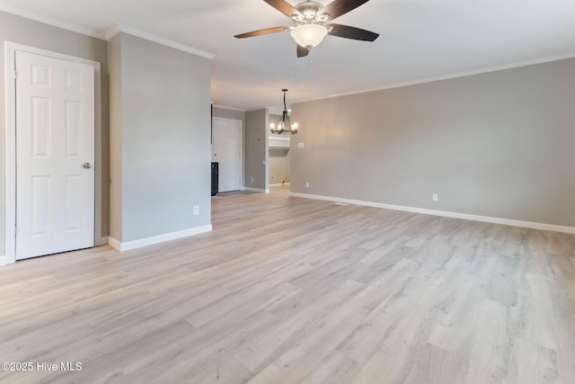 spare room featuring ornamental molding, ceiling fan with notable chandelier, and light hardwood / wood-style flooring