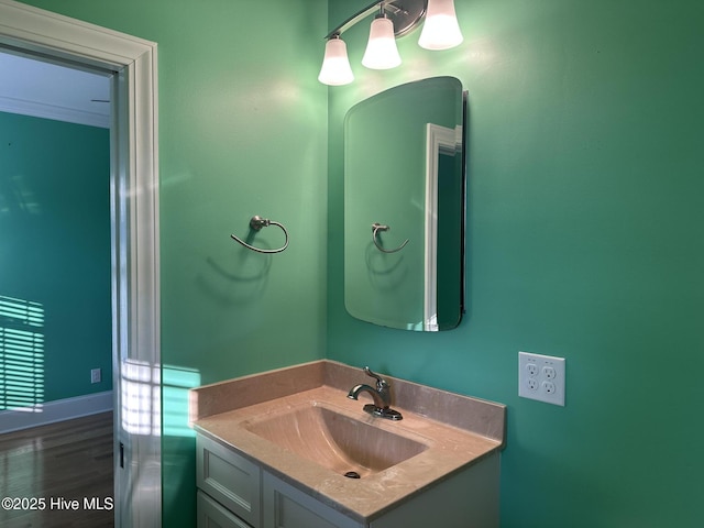 bathroom with vanity and wood finished floors