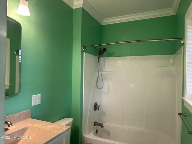 bathroom featuring vanity, crown molding, toilet, and shower / bathtub combination