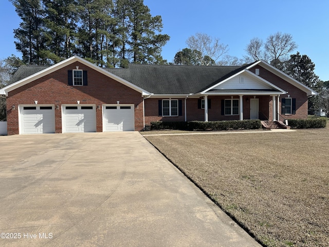 view of front of house featuring concrete driveway, a garage, and brick siding