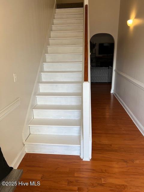 stairway with wood-type flooring