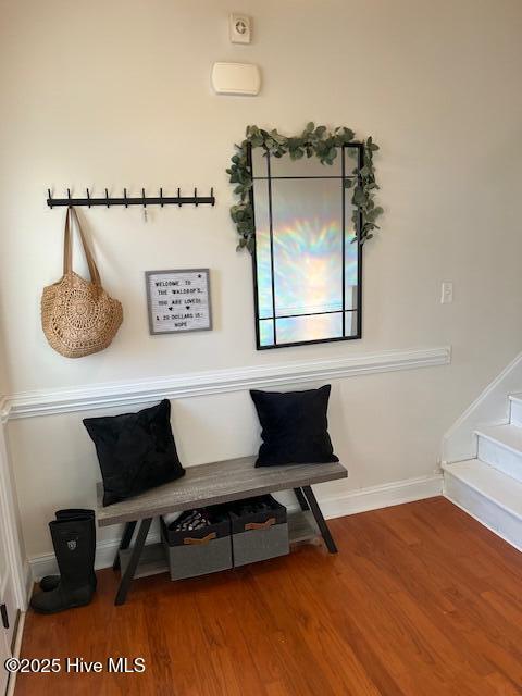 living area with hardwood / wood-style flooring