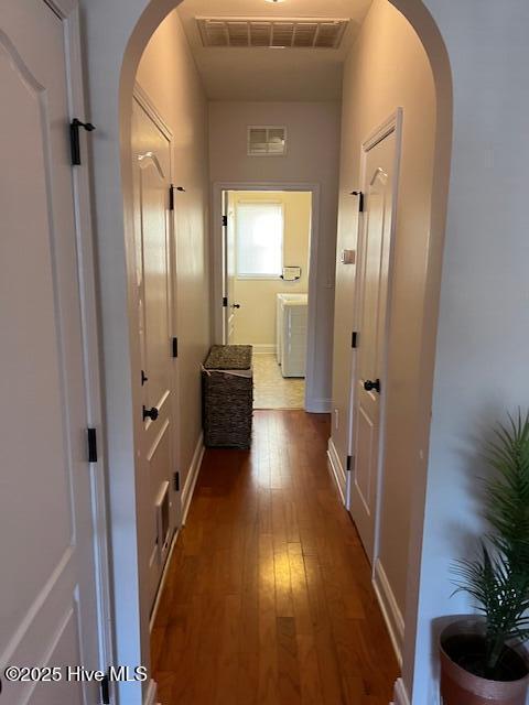 hall with dark hardwood / wood-style flooring