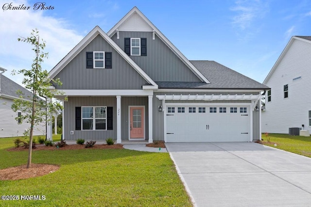 view of front of house with a garage and a front lawn