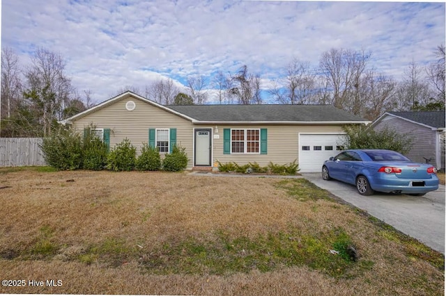 ranch-style house featuring a garage and a front lawn