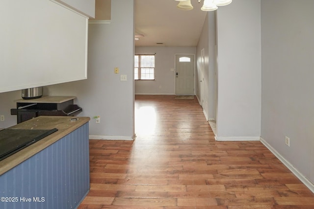 entrance foyer featuring hardwood / wood-style flooring and an inviting chandelier