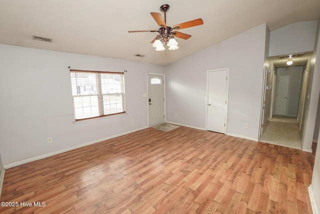 interior space featuring ceiling fan, lofted ceiling, and light hardwood / wood-style floors