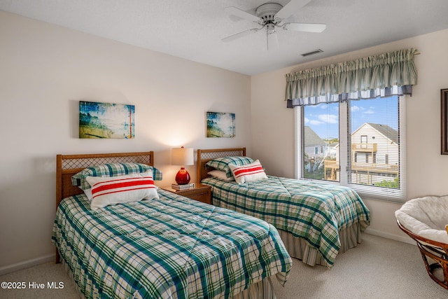 bedroom with ceiling fan and carpet