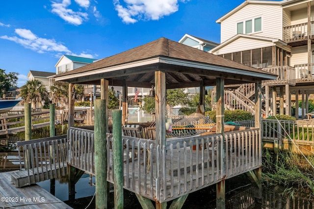 view of property's community featuring a wooden deck and a gazebo