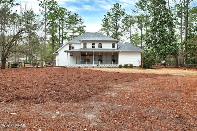 back of house featuring a sunroom