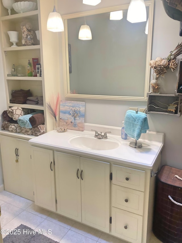 bathroom with tile patterned flooring, vanity, and built in shelves