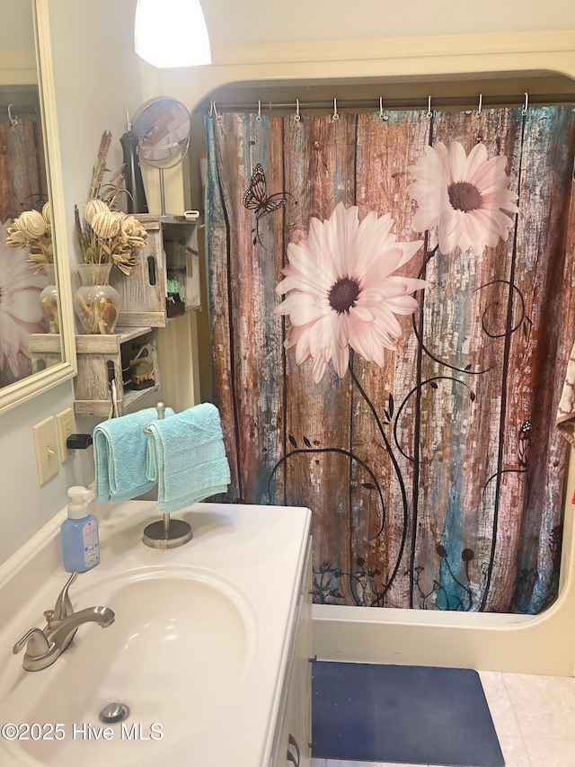 bathroom featuring tile patterned floors and sink