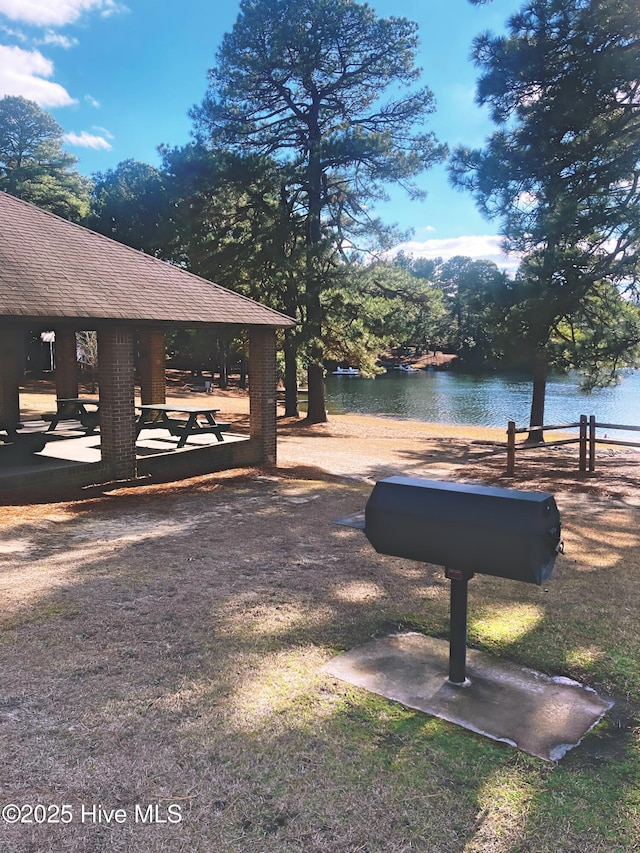 view of yard with a water view and a gazebo