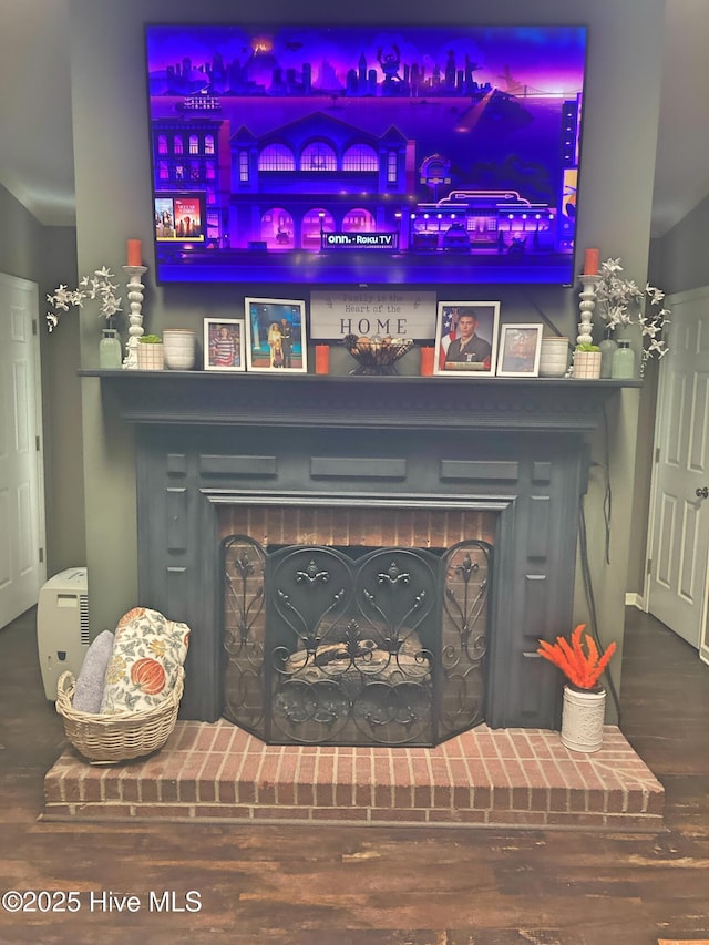 interior details with hardwood / wood-style flooring and a fireplace