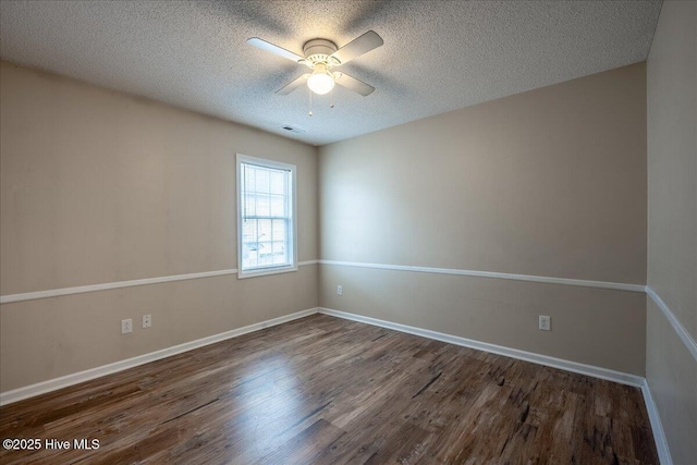 unfurnished room with a textured ceiling, dark hardwood / wood-style floors, and ceiling fan