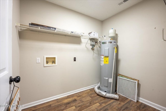 laundry area featuring washer hookup, dark hardwood / wood-style flooring, electric water heater, and electric dryer hookup