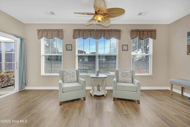 sitting room featuring ceiling fan and light hardwood / wood-style floors