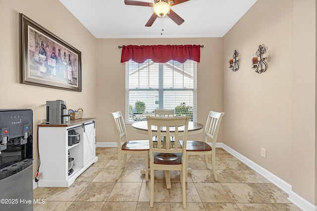 tiled dining room with ceiling fan