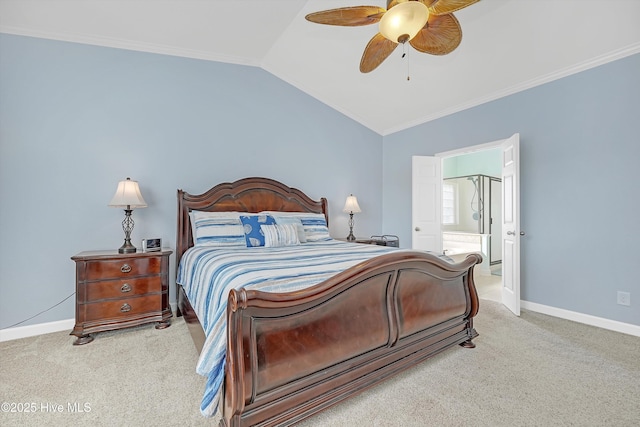 carpeted bedroom with ceiling fan, ornamental molding, lofted ceiling, and connected bathroom