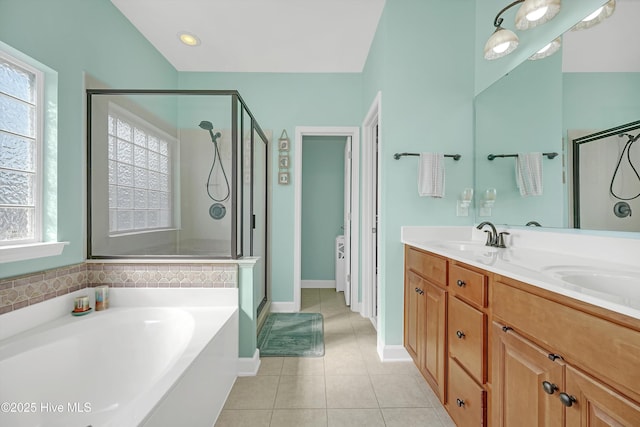 bathroom with tile patterned flooring, independent shower and bath, and a healthy amount of sunlight