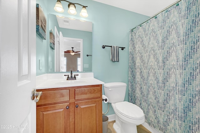 bathroom featuring walk in shower, vanity, and toilet