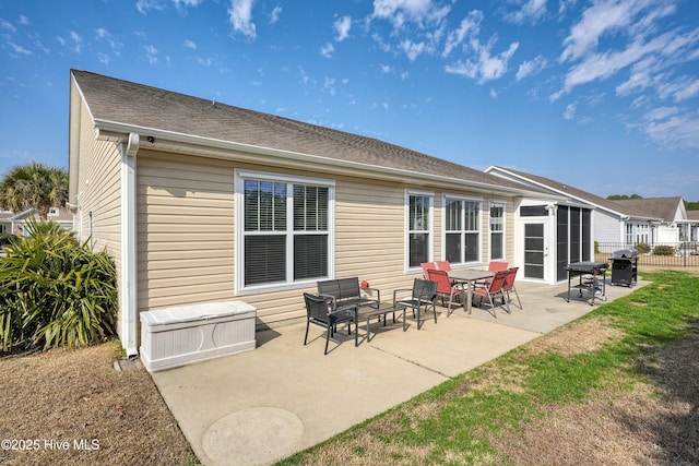 rear view of property with a patio area