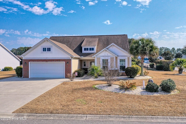 view of front of house with a garage and a front yard