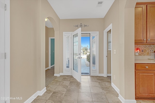 entrance foyer featuring light tile patterned floors