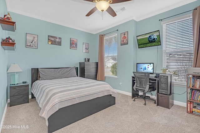 bedroom with crown molding, ceiling fan, light carpet, and multiple windows