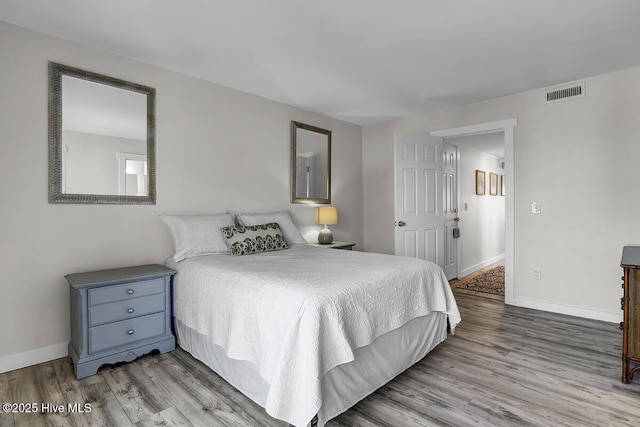 bedroom with light wood-type flooring