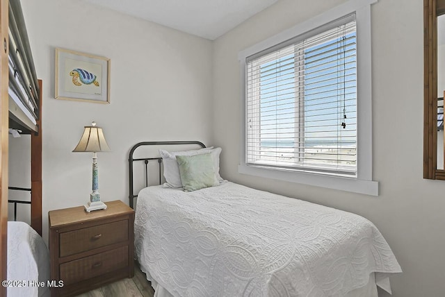 bedroom with hardwood / wood-style floors