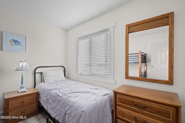 bedroom featuring wood finished floors