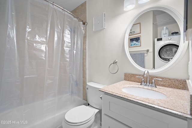 full bath with shower / tub combo, washer / clothes dryer, vanity, and toilet