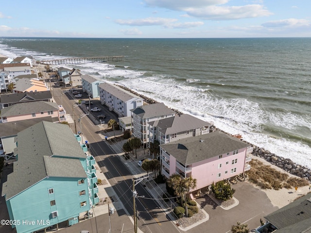 bird's eye view with a water view and a view of the beach