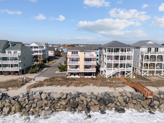 view of property with uncovered parking