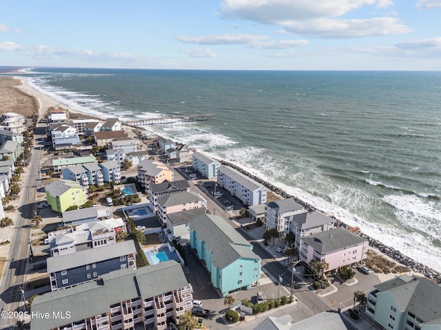 bird's eye view featuring a view of the beach and a water view